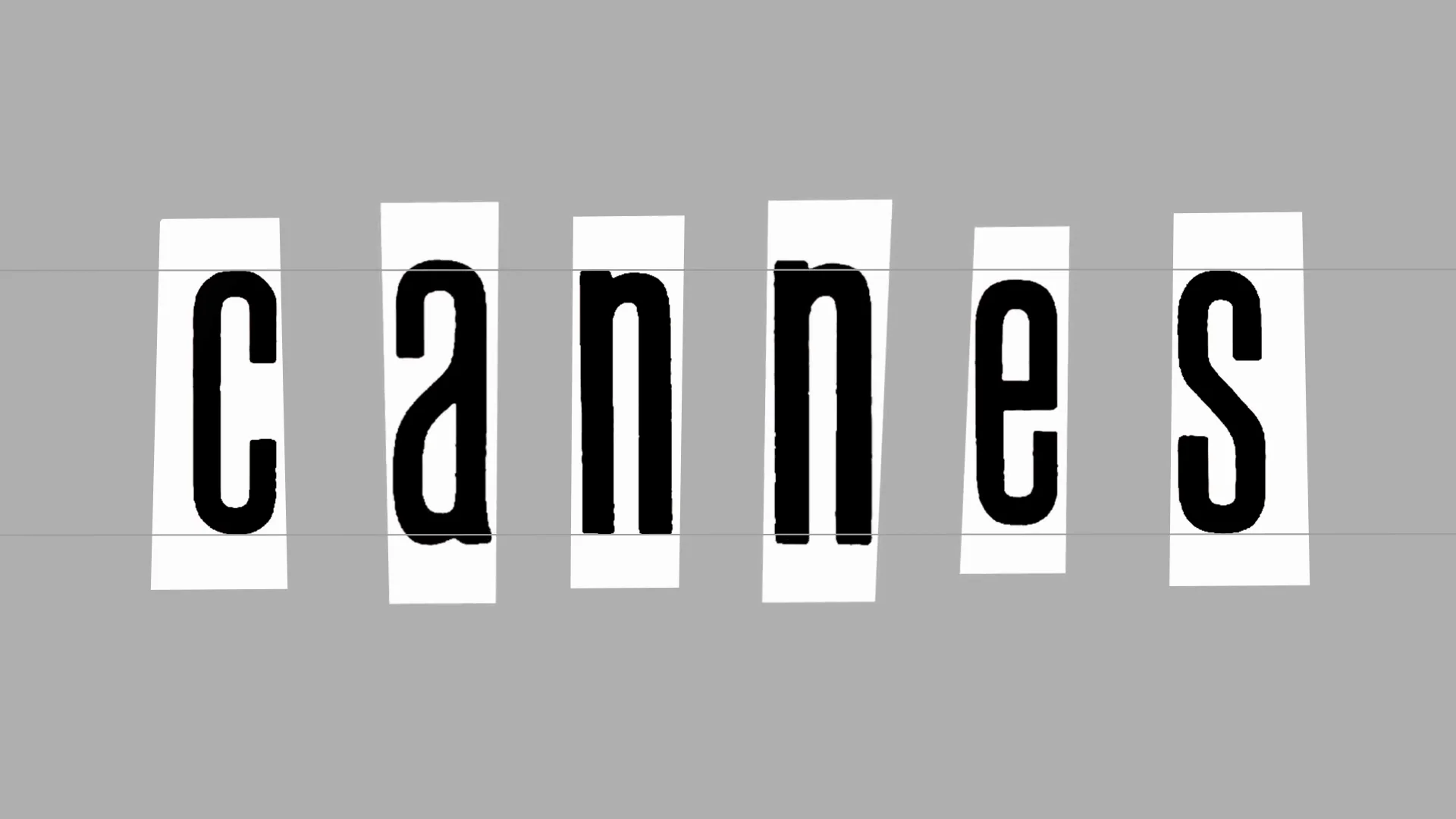 Capture de la vidéo : lettres du mot « Cannes », écrites dans un lettrage noir et étroit, apparaissant comme découpées dans du papier.