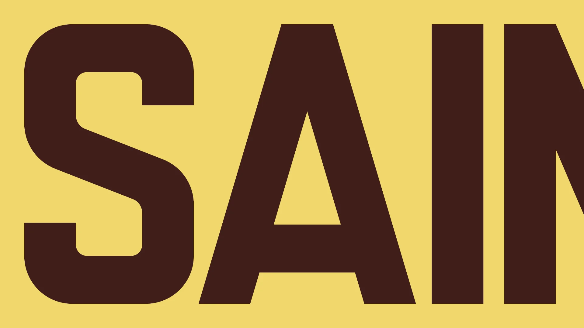 Démonstration du lettrage Carrossage avec les lettres S, A, et I, en brun sur fond jaune.